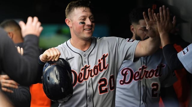 May 8, 2025; Denver, Colorado, USA; Detroit Tigers first base Spencer Torkelson (20) celebrates scoring a run in the third inning against the Colorado Rockies at Coors Field. Mandatory Credit: Ron Chenoy-Imagn Images