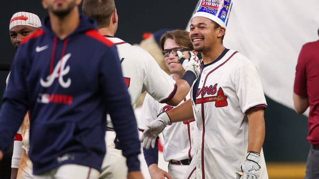 Braves rookie Drake Baldwin celebrates with teammates after hitting a walk-off single during the 11th inning of a 5-4 victory over the Reds on Thursday.