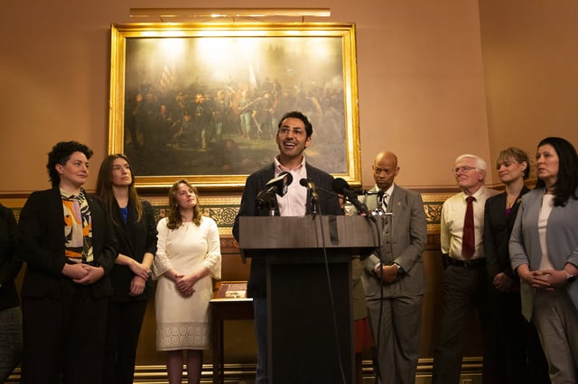 Mohsen Mahdawi, center, speaks during a press conference announcing the launch of the Vermont Immigration Legal Defense Fund in the Cedar Creek Reception Room at the Vermont State House on Thursday, May 8, 2025, in Montpelier, Vt. (AP Photo/Alex Driehaus)