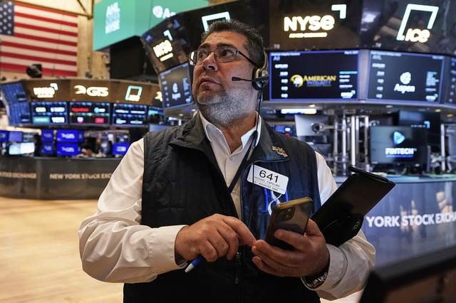 Trader Michael Capolino works on the floor of the New York Stock Exchange, Thursday, May 8, 2025. (AP Photo/Richard Drew)
