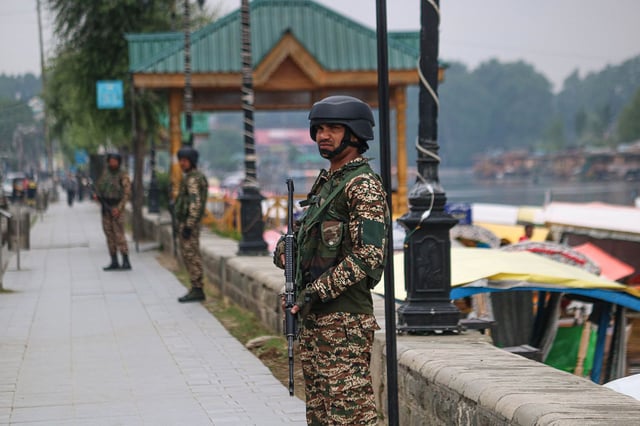 An Indian paramilitary soldier guards along the banks of Dal Lake in Srinagar, Jammu and Kashmir, on May 9, 2025.