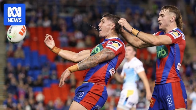 Dylan Lucas of the Knights celebrates a try with teammates