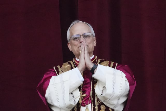 Newly elected Pope Leo XIV appears at the balcony of St. Peter&#39;s Basilica at the Vatican, Thursday, May 8, 2025. (AP Photo/Alessandra Tarantino)