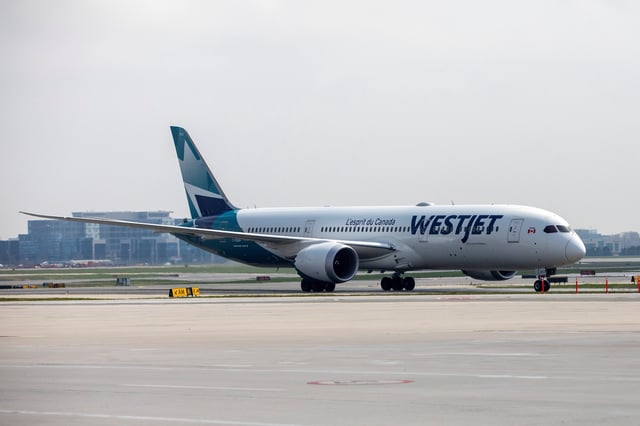 A WestJet Boeing 787-9 Dreamliner airplane taxis along a runway at Toronto Pearson Airport in Mississauga, Ontario, Canada April 28, 2021. REUTERS/Carlos Osorio/File photo