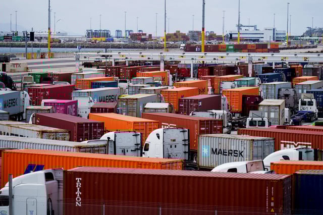 Trucks carrying shipping containers at the Port of Los Angeles on March 6, 2025. 