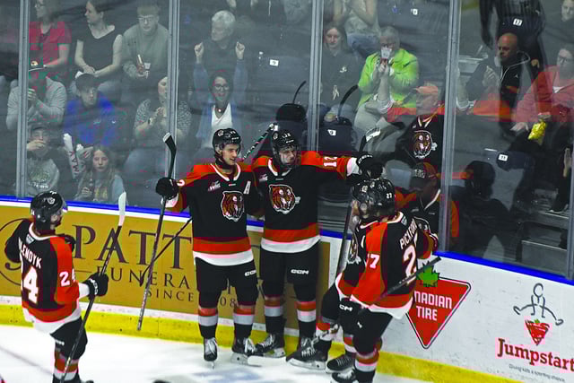 NEWS PHOTO JAMES TUBB Medicine Hat Tigers rookie forward Liam Ruck (middle) celebrates his power play goal in the second period of Game 2 on April 26 in the Eastern Conference Championship series against the Lethbridge Hurricanes at Co-op Place.