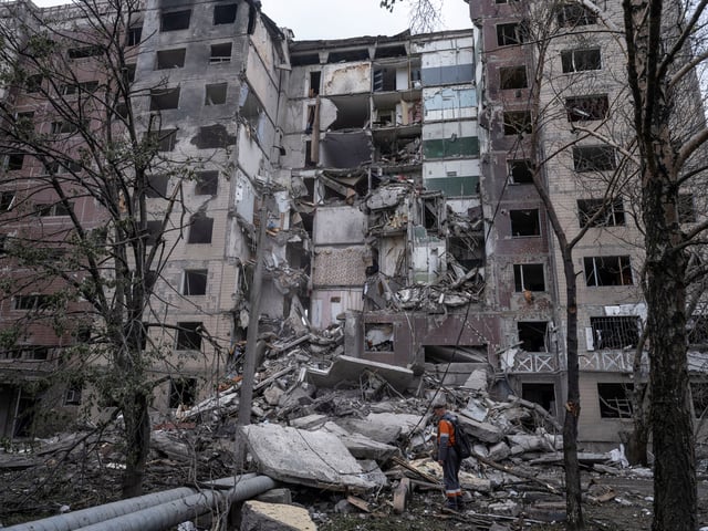 A municipal worker stands in front of an apartment building heavily damaged a day before, by a Russian air strike, amid Russia's attack on Ukraine, in the frontline town of Kostiantynivka, in Donetsk region, Ukraine May 8, 2025. Iryna Rybakova/Press Service of the 93rd Kholodnyi Yar Separate Mechanized Brigade of the Ukrainian Armed Forces/Handout via REUTERS