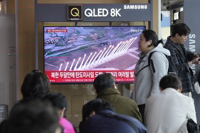 A TV screen shows a file image of North Korea's missiles launch during a news program at Seoul Railway Station in Seoul, South Korea, Thursday, May 8, 2025. (AP Photo/Ahn Young-joon)