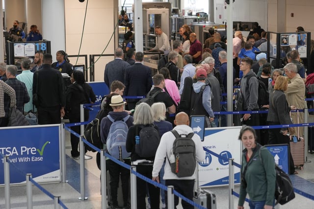 Travelers make their way through security at Newark Liberty International Airport in Newark, New Jersey, on May 5, 2025. The airport has been hit with recent delays and cancelations.