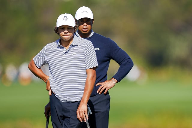 ORLANDO, FLORIDA - DECEMBER 21: Tiger Woods and his son Charlie Woods look over a putt on the fifth hole during the first round of the PNC Championship at Ritz-Carlton Golf Club on December 21, 2024 in Orlando, Florida. (Photo by Mike Ehrmann/Getty Images)