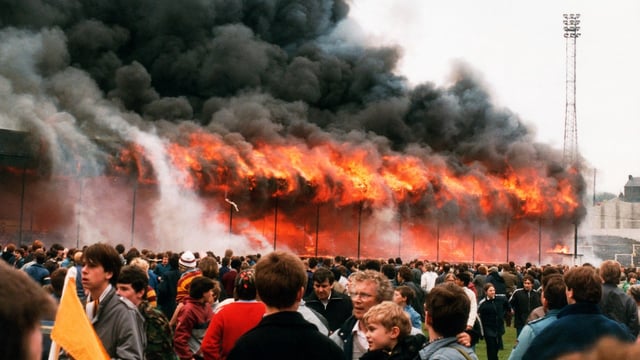 A devastating fire rips through the main stand at Bradford City’s Valley Parade on May 11, 1985