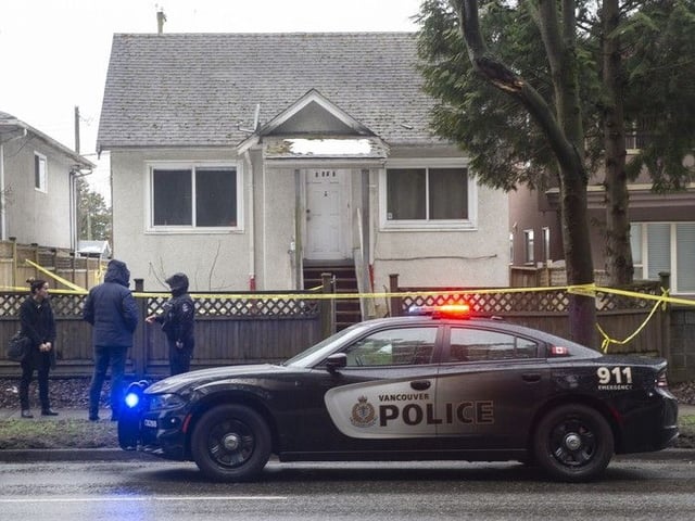 Vancouver police investigate a murder at a residence in the 5900-block Boundary Road in Vancouver, BC Saturday, March 4, 2023. Caleb Morin was later identified as the victim. 