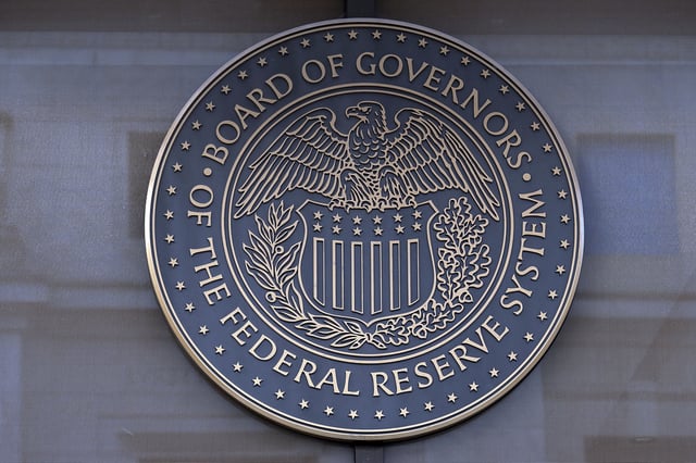 FILE - The seal of the Federal Reserve Board is seen at the Building in Washington, Saturday, Dec. 8, 2024. (AP Photo/Jose Luis Magana)