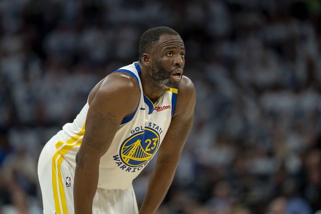Golden State Warriors forward Draymond Green looks on against the Minnesota Timberwolves in the second half during Game 2 of the second round of the NBA playoffs at Target Center.