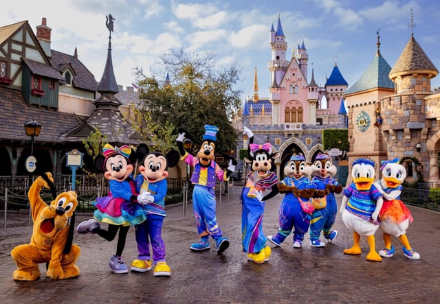 Disney characters in their “Celebrate Happy” outfits for the Disneyland 70th anniversary celebration. (Courtesy of Disneyland)