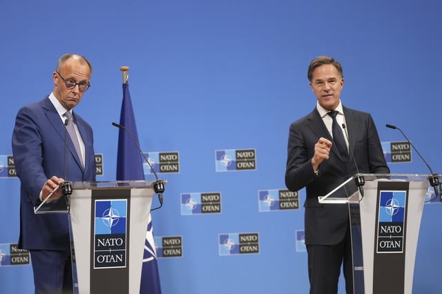 Germany's Chancellor Friedrich Merz, left, and NATO Secretary General Mark Rutte address the media at NATO headquarters in Brussels, Friday, May 9, 2025. (AP Photo/Virginia Mayo)