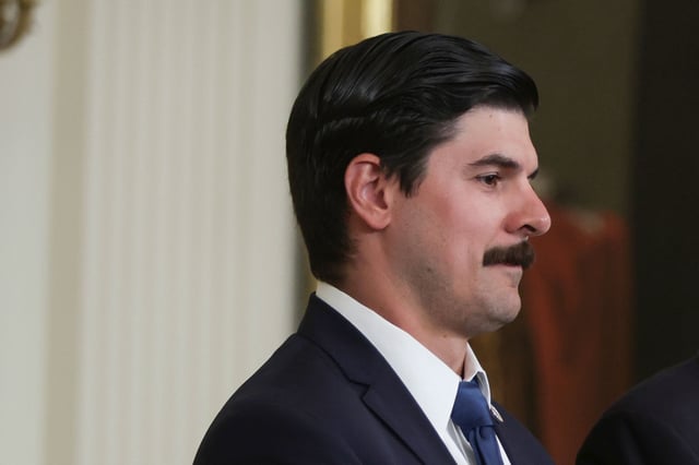 Richard Trumka Jr. accepts the Presidential Medal of Freedom on behalf of his father the late Richard Trumka, president of the AFL-CIO, from U.S. President Joe Biden during a ceremony in the East Room of the White House July 7, 2022 in Washington, DC.