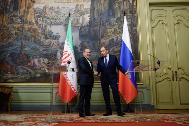 Russia's Foreign Minister Sergei Lavrov and Iran's Foreign Minister Abbas Araqchi shake hands during a press conference following their talks in Moscow, Russia, April 18, 2025. Tatyana Makeyeva/Pool via REUTERS/File Photo