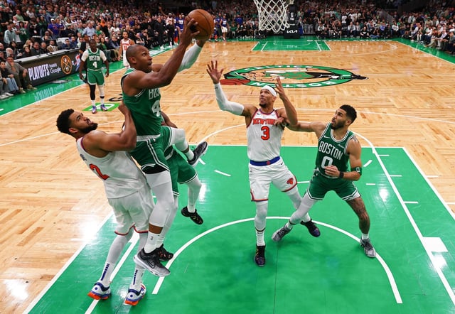 BOSTON, MASSACHUSETTS - MAY 07:  Al Horford #42 of the Boston Celtics grabs the rebound against Karl-Anthony Towns #32 of the New York Knicks during the fourth quarter in Game Two of the Eastern Conference Second Round NBA Playoffs at TD Garden on May 07, 2025 in Boston, Massachusetts. NOTE TO USER: User expressly acknowledges and agrees that, by downloading and or using this photograph, User is consenting to the terms and conditions of the Getty Images License Agreement. (Photo by Maddie Meyer/Getty Images)