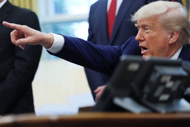 U.S. President Donald Trump takes questions as he makes an announcement about a trade deal with the U.K., in the Oval Office at the White House in Washington, D.C., U.S., May 8, 2025. REUTERS/Leah Millis
