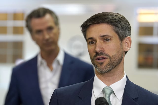 San Jose Mayor Matt Mahan, right, discusses California Gov. Gavin Newsom&#39;s, left, proposal to build 1,200 small homes across the state to reduce homelessness, during the first of a four-day tour of the state in Sacramento Calif., on Thursday, March 16, 2023.