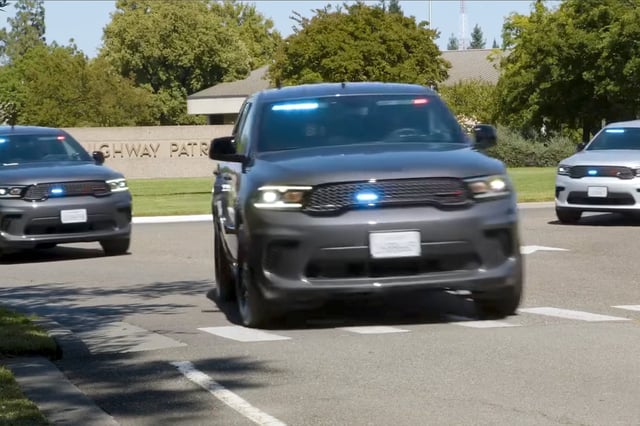 Red and blue lights tucked into the Durango’s front windshield and grille indicate that its driver is a CHP officer.