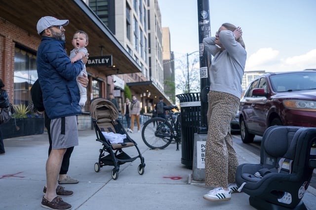 Elizabeth Mahon, owner of the baby store Three Littles, prepared to install a new car seat for a customer who made the purchase ahead of tarriff-driven price increases, at the Union Market location in Washington, on Wednesday, April 16, 2025. (AP Photo/Nathan Howard)