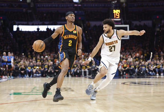 Oklahoma City Thunder guard Shai Gilgeous-Alexander (2) drives down the court beside Denver Nuggets guard Jamal Murray (27) during Game 2 of their playoff series on May 7, 2025.