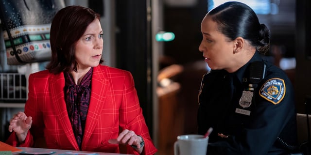 Carrie Preston as Elsbeth Tascioni sitting next to Carra Patterson in Episode 3 of Season 1 of CBS' Elsbeth