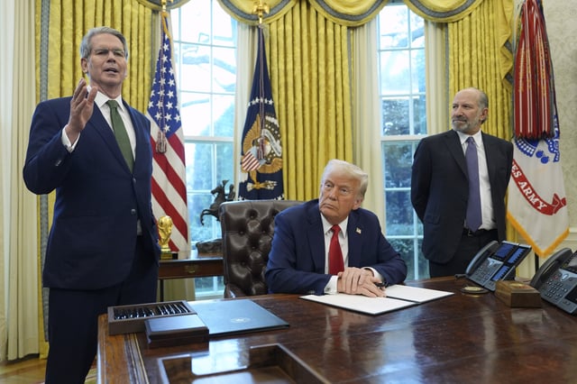 Treasury Secretary Scott Bessent, from left, speaks as President Donald Trump and Commerce Secretary nominee Howard Lutnick listen as Trump prepares to sign an executive order in the Oval Office of the White House, Monday, Feb. 3, 2025, in Washington.