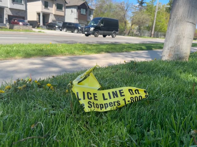 Toronto Police tape at the scene on Birchmount Rd., north of Anaconda Ave., the day after a woman was fatally struck by two vehicles that did not remain, Friday, May 9, 2025.