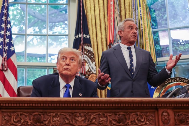 U.S. Secretary of Health and Human Services Robert F. Kennedy Jr. (right) speaks next President Donald Trump at the White House in Washington on May 5, 2025.