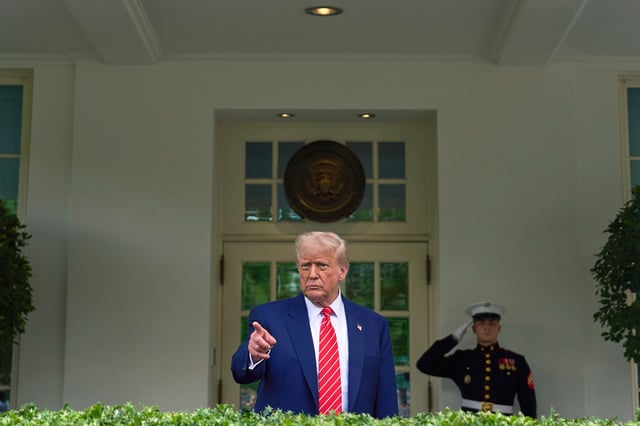 President Donald Trump speaks to reporters outside the West Wing of the White House on Thursday, May 8, 2025.