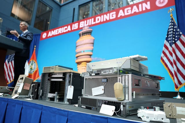 U.S. Transportation Secretary Sean Duffy is surrounded onstage by units representing outdated air traffic control equipment still in use as he launches an air traffic control infrastructure plan during an event at the Transportation Department in Washington, D.C., U.S., May 8, 2025. REUTERS/Jonathan Ernst
