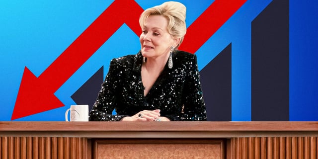 Custom image of Jean Smart as Deborah in Hacks, sitting at her desk with a red arrow pointing downwards behind her
