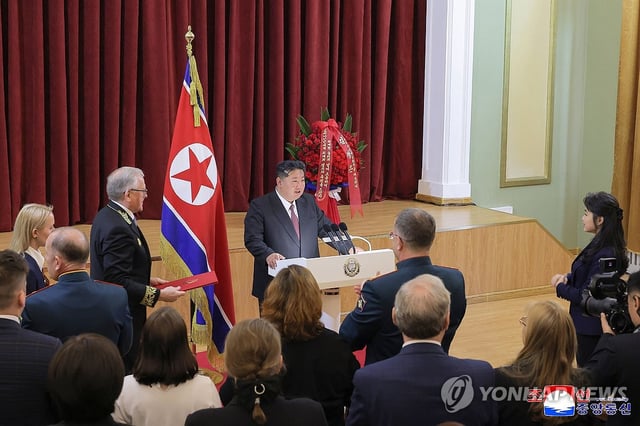 This photo, carried by North Korea's official Korean Central News Agency on May 10, 2025, shows the North's leader Kim Jong-un (C) delivering a speech during his visit to the Russian Embassy in Pyongyang the previous day to mark the 80th anniversary of the Soviet Union's defeat of Nazi Germany in World War II. (For Use Only in the Republic of Korea. No Redistribution) (Yonhap)