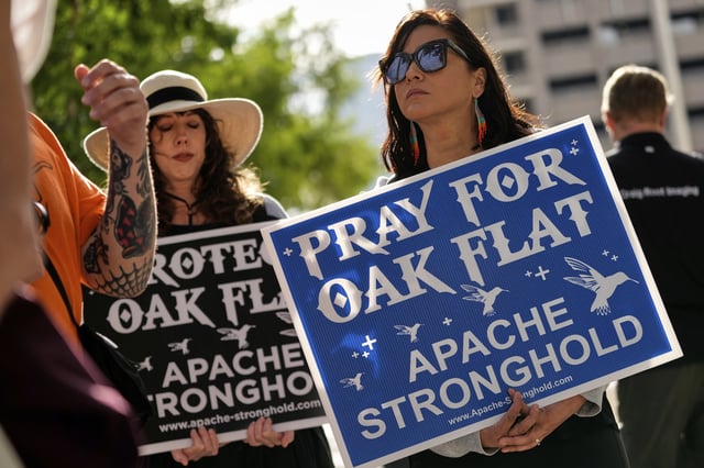 Members of Apache and others who want to halt a massive copper mining project on federal land in Arizona gather outside the U.S. District Court, Wednesday, May 7, 2025, in Phoenix. (AP Photo/Matt York)
