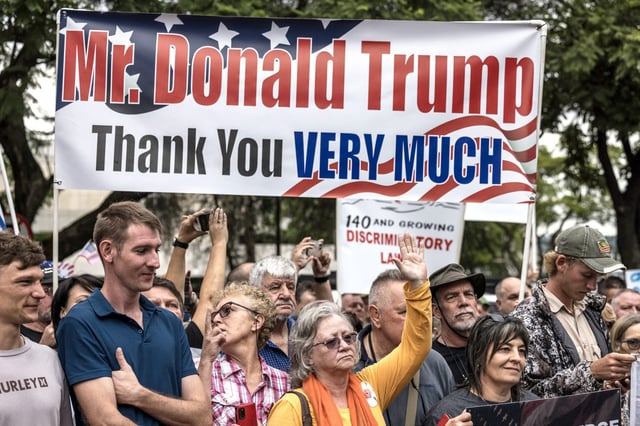 White South Africans supporting President Donald Trump and South African and US tech billionaire Elon Musk gather for a demonstration in front of the US Embassy in Pretoria, on Feb. 15, 2025.