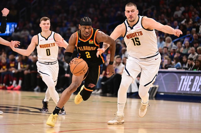 Shai Gilgeous-Alexander #2 of the Oklahoma City Thunder attempts to drive past Nikola Jokic #15 of the Denver Nuggets during the first half at Paycom Center on March 9, 2025 in Oklahoma City, Oklahoma.