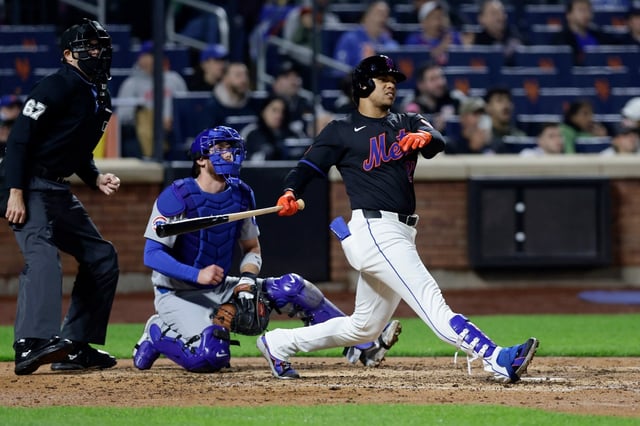 NEW YORK, NEW YORK - MAY 09:  Juan Soto #22 of the New York Mets follows through on his fourth inning home run against the Chicago Cubs at Citi Field on May 09, 2025 in New York City. (Photo by Jim McIsaac/Getty Images)
