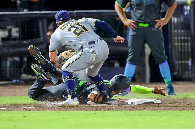 Milwaukee&#39;s Caleb Durbin is called for interference on the Rays&#39; Christopher Morel,  allowing him to score during the sixth inning Friday night at  Steinbrenner Field in Tampa. (Photo by Mike Carlson/Getty Images)