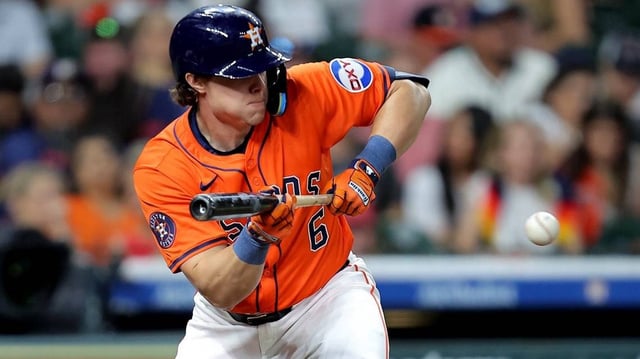 May 9, 2025; Houston, Texas, USA; Houston Astros center fielder Jake Meyers (6) bunts against the Cincinnati Reds during the fourth inning at Daikin Park. Mandatory Credit: Erik Williams-Imagn Images
