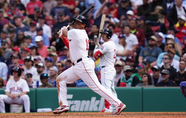 May 8, 2025; Boston, Massachusetts, USA; Boston Red Sox designated hitter Rafael Devers (11) hits a home run against the Texas Rangers in the seventh inning at Fenway Park. David Butler II-Imagn Images
