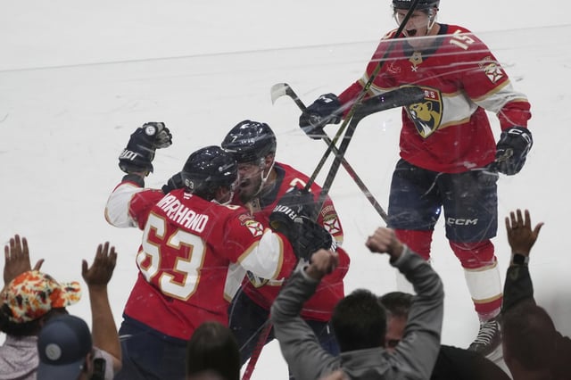Florida Panthers center Brad Marchand (63) celebrates after scoring the game winning goal during overtime in Game 3 of a second-round NHL hockey playoff series Toronto Maple Leafs, Friday, May 9, 2025, in Sunrise, Fla. (AP Photo/Marta Lavandier)