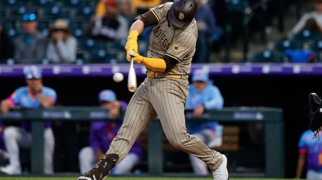 May 9, 2025; Denver, Colorado, USA; San Diego Padres designated hitter Gavin Sheets (30) hits an RBI double in the fifth inning against the Colorado Rockies at Coors Field. Mandatory Credit: Isaiah J. Downing-Imagn Images