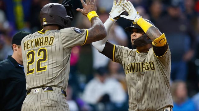 The San Diego Padres’ Martin Maldonado, right, celebrates his two-run home run with teammate Jason Heyward (22) in the fifth inning against the Colorado Rockies at Coors Field on Friday, May 9, 2025, in Denver. (Justin Edmonds/Getty Images/TNS)
