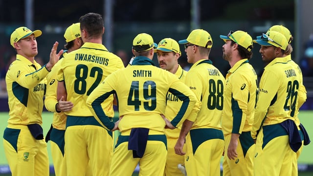 Australia's Ben Dwarshuis (3L) celebrates with teammates