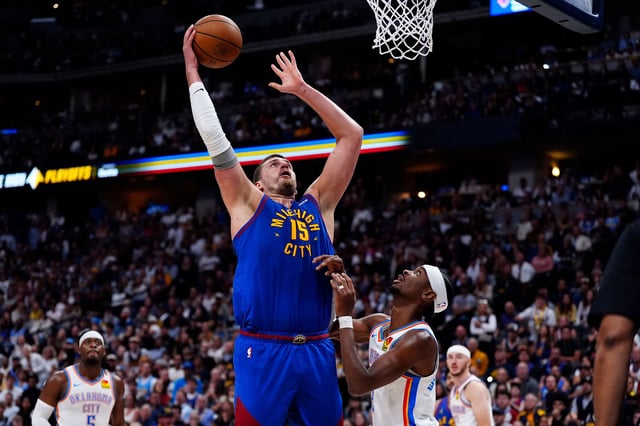 Nikola Jokić shoots the ball over MVP rival Shai Gilgeous-Alexander.