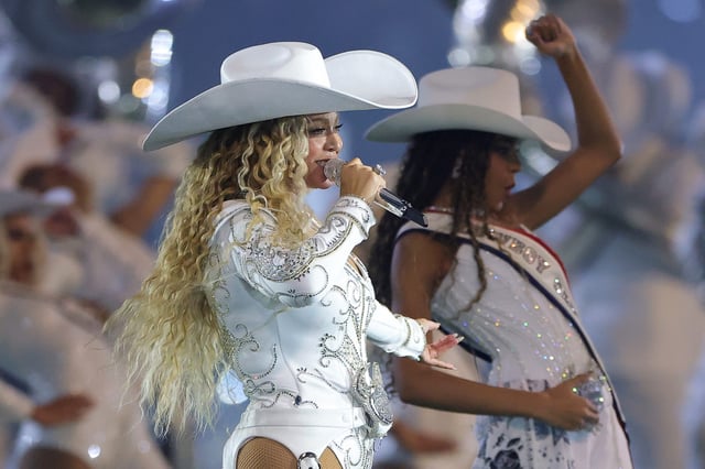 HOUSTON, TEXAS - DECEMBER 25: BeyoncÃ© performs with daughter, Blue Ivy, during the halftime show for the game between the Baltimore Ravens and the Houston Texans at NRG Stadium on December 25, 2024 in Houston, Texas. (Photo by Alex Slitz/Getty Images)