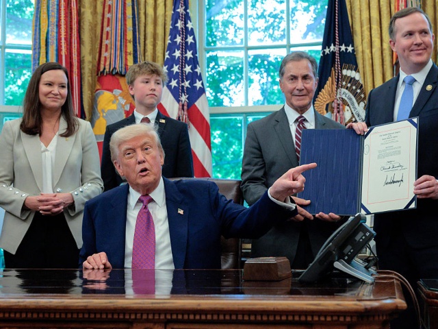 WASHINGTON, DC - MAY 09: U.S. President Donald Trump is joined by Republican lawmakers, (L-R) Sen. Ashley Moody (R-FL), her son Connor, Rep. Gary Palmer (R-AL) and Rep. Brian Jack (R-GA), after Trump signed Congressional resolutions  into law in the Oval Office at the White House on May 09, 2025 in Washington, DC. The resolutions were related to the regulation of residential appliances like refrigerators and ovens. (Photo by Chip Somodevilla/Getty Images)